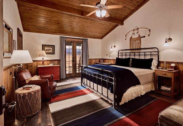 the lodge at trinchera reserve and lodge queen room with doors to patio