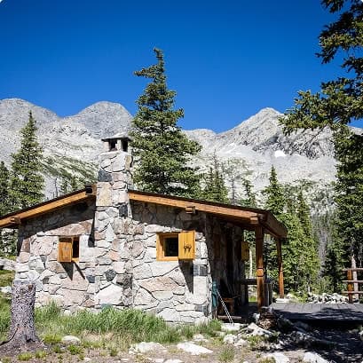 stone cabin in the woods